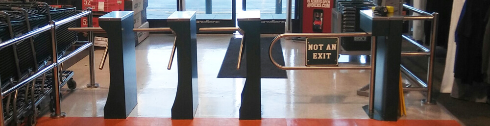 Waist high turnstiles in lobby of retail store